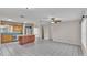 Open kitchen with granite island, stainless steel appliances, and wood cabinets at 6110 Downing St, Dover, FL 33527