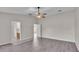 Spacious bedroom with vinyl plank flooring and access to bathroom at 6110 Downing St, Dover, FL 33527