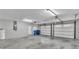Two-car garage with extra storage space and overhead door at 6110 Downing St, Dover, FL 33527