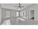 Spacious living room with tile floors and access to sunroom at 6110 Downing St, Dover, FL 33527