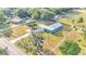 House with a large yard and a long driveway at 6110 Downing St, Dover, FL 33527
