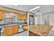 Kitchen features granite countertops, stainless steel appliances, and wood cabinets at 6110 Downing St, Dover, FL 33527