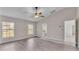 Bedroom with vinyl plank flooring and ceiling fan at 6110 Downing St, Dover, FL 33527