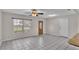 Bright living room with tile flooring and neutral walls at 6110 Downing St, Dover, FL 33527