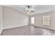 Living room with vinyl plank flooring and ceiling fan at 6110 Downing St, Dover, FL 33527