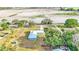 House with a large yard and a long driveway at 6110 Downing St, Dover, FL 33527