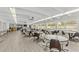 Community room with tables and chairs, great for gatherings at 9945 47Th N Ave # 110, St Petersburg, FL 33708