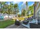Spacious backyard with seating areas, manicured lawn, and privacy fence, ideal for outdoor entertaining at 9945 47Th N Ave # 110, St Petersburg, FL 33708
