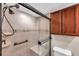 Modern bathroom with walk-in shower, sleek fixtures, and built-in bench for comfort at 9945 47Th N Ave # 110, St Petersburg, FL 33708