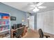 Cozy bedroom featuring a ceiling fan, spacious closet, and neutral decor at 9945 47Th N Ave # 110, St Petersburg, FL 33708
