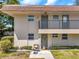 Charming condo featuring an inviting entrance with a 'Welcome' sign and cozy seating area at 9945 47Th N Ave # 110, St Petersburg, FL 33708
