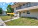 Inviting condo exterior, featuring a welcoming entrance, perfect for relaxing and enjoying the outdoors at 9945 47Th N Ave # 110, St Petersburg, FL 33708