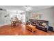 Inviting living space with hardwood floors, an open floor plan, and natural light at 9945 47Th N Ave # 110, St Petersburg, FL 33708