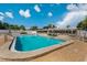 Community pool with surrounding patio and seating at 9945 47Th N Ave # 110, St Petersburg, FL 33708