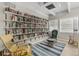 Cozy community library with rocking chairs and bookshelves at 9945 47Th N Ave # 110, St Petersburg, FL 33708