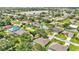 Aerial shot of a beautiful residential neighborhood with lake views and well-manicured lawns at 23338 Duchess Ave, Port Charlotte, FL 33954