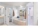 Bright bathroom featuring a jacuzzi tub, a shower, and an open design at 23338 Duchess Ave, Port Charlotte, FL 33954