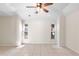 Neutral bedroom with tray ceiling and two windows offering plenty of natural light at 23338 Duchess Ave, Port Charlotte, FL 33954