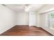 This bedroom features new laminate flooring, a ceiling fan and a closet at 23338 Duchess Ave, Port Charlotte, FL 33954