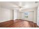 This bedroom features new laminate flooring, a ceiling fan and a closet at 23338 Duchess Ave, Port Charlotte, FL 33954