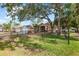 Charming single-story home with a well-maintained lawn and mature trees at 23338 Duchess Ave, Port Charlotte, FL 33954