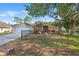 Charming single-story home with well-maintained lawn and mature trees, offering great curb appeal at 23338 Duchess Ave, Port Charlotte, FL 33954