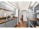 Modern kitchen with stainless steel appliances, subway tile backsplash, and butcher block countertops at 23338 Duchess Ave, Port Charlotte, FL 33954