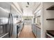Updated kitchen featuring stainless steel appliances, butcher block countertops, and ample cabinet space at 23338 Duchess Ave, Port Charlotte, FL 33954