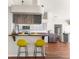 The kitchen showcases a breakfast bar with seating and modern appliances, offering a stylish dining experience at 23338 Duchess Ave, Port Charlotte, FL 33954