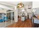 Open kitchen with gray cabinets, modern appliances, and hardwood floors at 23338 Duchess Ave, Port Charlotte, FL 33954