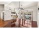 Spacious living room with high ceilings, hardwood floors, and sliding glass doors to the pool at 23338 Duchess Ave, Port Charlotte, FL 33954