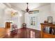 Bright living room boasts hardwood floors, neutral walls, and a stylish ceiling fan for comfortable living at 23338 Duchess Ave, Port Charlotte, FL 33954