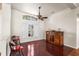 Charming living room featuring hardwood floors, a decorative window, and comfortable seating at 23338 Duchess Ave, Port Charlotte, FL 33954