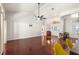Bright and airy living room showcasing hardwood floors, high ceilings, and an open layout at 23338 Duchess Ave, Port Charlotte, FL 33954