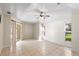 Large main bedroom featuring neutral paint, tile flooring, and sliding glass door to lanai at 23338 Duchess Ave, Port Charlotte, FL 33954