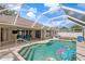 Relaxing screened-in pool area with lounge chairs and a clear blue swimming pool at 23338 Duchess Ave, Port Charlotte, FL 33954