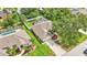 Aerial view of a house with a pool and driveway at 23338 Duchess Ave, Port Charlotte, FL 33954