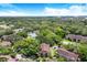 Aerial view of community featuring tennis courts and lush landscaping at 14313 Hanging Moss Cir # 202, Tampa, FL 33613