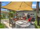 Covered patio with seating area and string lights at 4308 S Trask St, Tampa, FL 33611