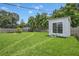 Large backyard with a shed and grassy area at 4308 S Trask St, Tampa, FL 33611