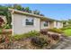 Tan single story house with white shutters and nicely landscaped yard at 2209 Jerri Lynn Ct, Plant City, FL 33567