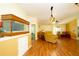 Living room featuring wood floors, and built in aquarium at 7801 Glascow Dr, New Port Richey, FL 34653