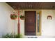 Dark brown front door with decorative screen door at 7801 Glascow Dr, New Port Richey, FL 34653