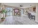 Living room with access to a patio and water view at 731 Ashentree Dr, Plant City, FL 33563