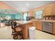 Kitchen with an island, stainless steel appliances, and view into living room at 10507 Goldwater Ln, Riverview, FL 33569