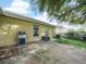 Brick paved patio with grill and partial backyard view at 10507 Goldwater Ln, Riverview, FL 33569