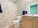 Clean bathroom with shower, toilet, and wood vanity at 10507 Goldwater Ln, Riverview, FL 33569
