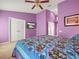 Bright bedroom with a large bed and double doors at 10507 Goldwater Ln, Riverview, FL 33569