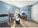 Home office with a desk, chair, and treadmill at 10507 Goldwater Ln, Riverview, FL 33569