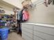 Large walk-in closet with shelves, drawers, and hanging rods at 10507 Goldwater Ln, Riverview, FL 33569